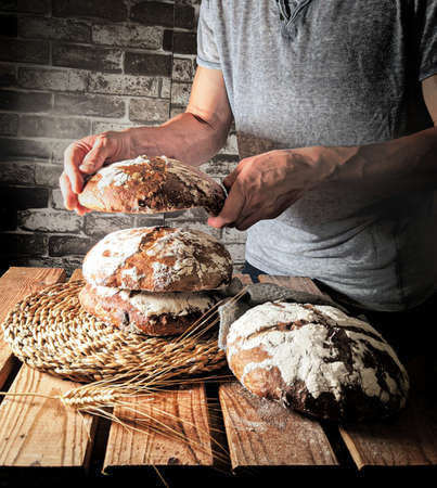 -baker placing his loaves