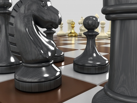 On the chessboard of black and white figures, one pawn gold. On a gray background.の写真素材
