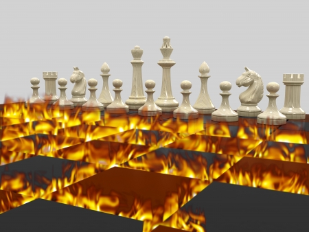 White chess pieces, board burns with a bright flame. On a gray background.の写真素材