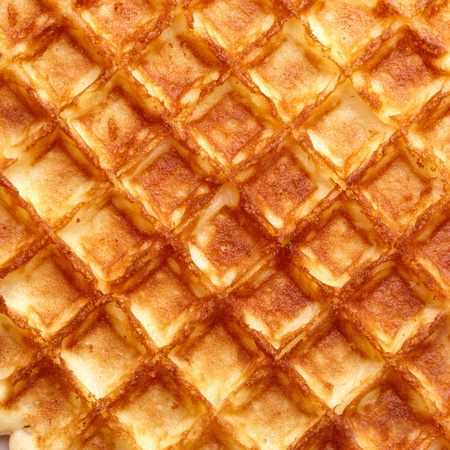 Freshly baked waffle texture. Top view.の写真素材