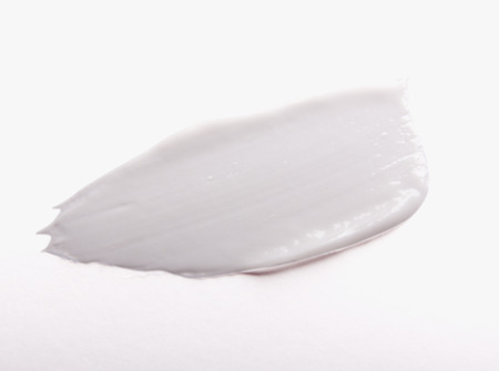 Smear cream isolated on white background. Cream texture.
