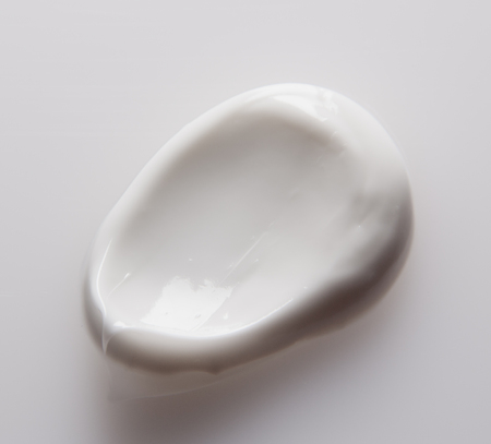 Smear cream isolated on white background. Cream texture.の写真素材