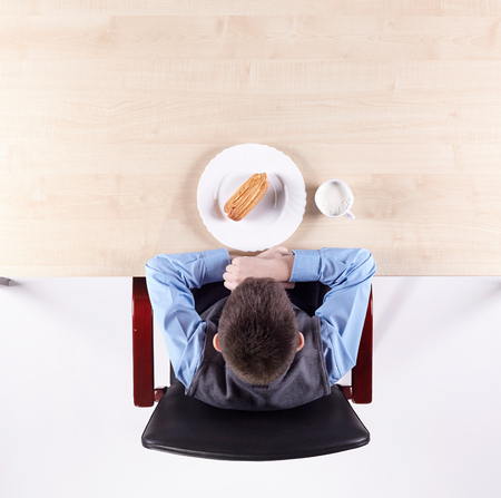 Boy sitting in a chair. Top view.の写真素材