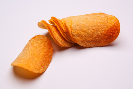 Potato chips isolated on white backgroundの写真素材