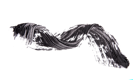 Brush strok of black shade of mascara on whiteの写真素材