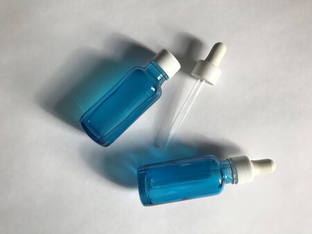 bubble with serum and a dropper in the sunlight. cosmetics for careの写真素材