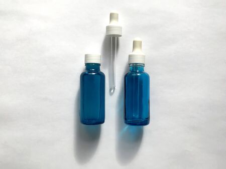 bubble with serum and a dropper in the sunlight. cosmetics for careの写真素材