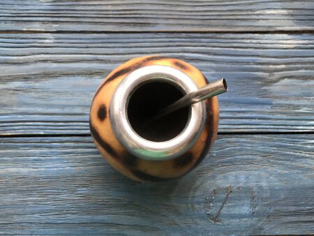 calabash and mate bombilla on wooden backgroundの写真素材