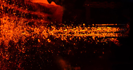 Metal on casting. Metallurgy.  High temperature in the melting furnace. Heavy forging steelmaking...