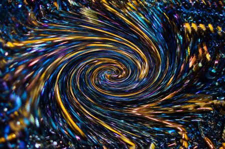 Spiral deepening wave texture for background and screen saver. Gold and blue metal shavings 3D