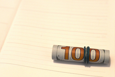 Stack of money dollars bounded by rubber. Corruption concept . Anti bribery and corruption concepts, money offered in file, giving money in fileの写真素材