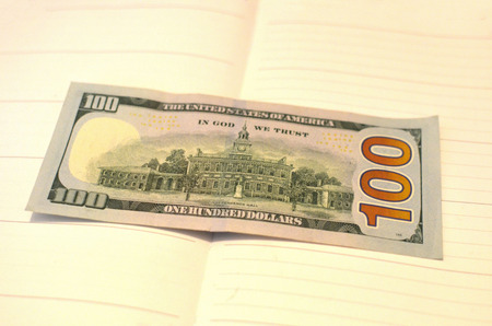 US one hundred dollar bills background. Money american hundred texture notes design. Financial concept. Financial operations. Investment, financial , donation concept, or bribe, corruption conceptの写真素材