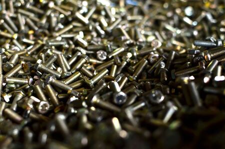 Background of screw bolts, Internal screw, bolts closeup, many screws. Factory equipment and...