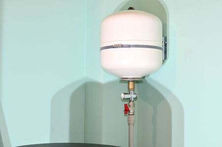Heating boiler, Water Heater Expansion Tank. Gallon Residential Pressurized Water Storage Tank for Reverse Osmosis (RO) Systems. Heating systems, installation of water supply for underfloor heating.の写真素材