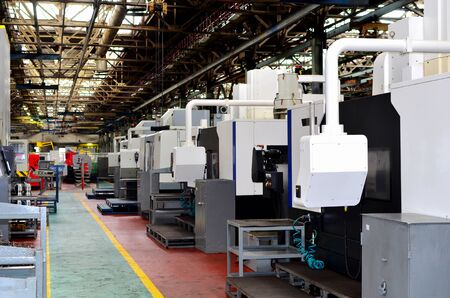 Workshop of a factory with automatic CNC turning machines. High precision computerized CNC plasma...