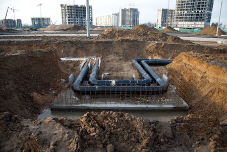 Laying of underground storm sewer pipes in ditch. Installation of water main and sanitary sewer at...