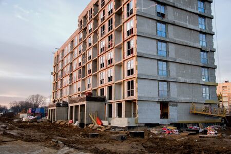 Suspended construction cradle on the background facade of the building. Mobile scaffolding platform...