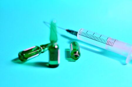 Medical syringe with a needle with injection.  The concept of emergency care for patients with acute pain. Anesthesia with essential and essential medicines, background, textures - Imageの写真素材