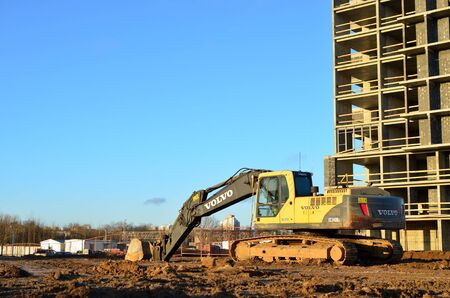 01.12.2019 Minsk, Belarus: Excavator VOLVO EC240Blc with bucket at construction siteのeditorial素材