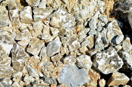 Natural gray gypsum stone. Close up image of stones with black and white. Industrial mining area....