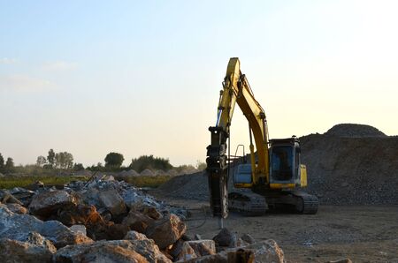 Crawler excavator with hydraulic breaker hammer for the destruction of concrete and hard rock at the...