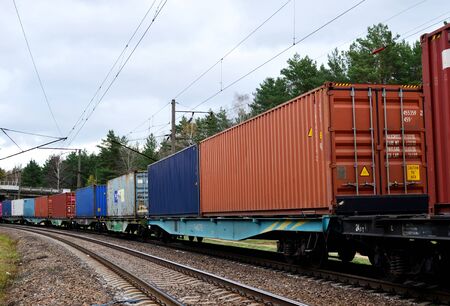 Freight train, transportation of railway cars by cargo containers shipping. Railway logistics...