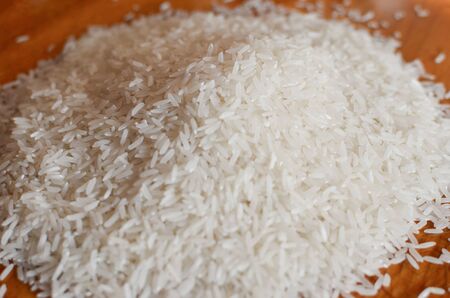Uncooked asian white rice or Long white rice grain as backgroundの写真素材