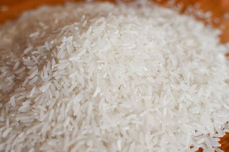 Uncooked asian white rice or Long white rice grain as backgroundの写真素材