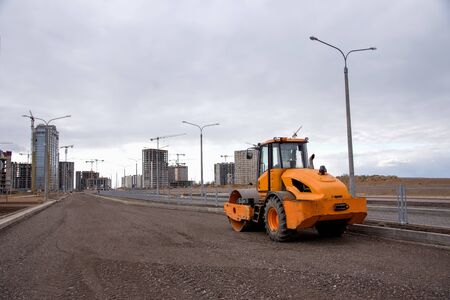 Soil Compactor at construction site. Vibration single-cylinder road roller for leveling soil,...