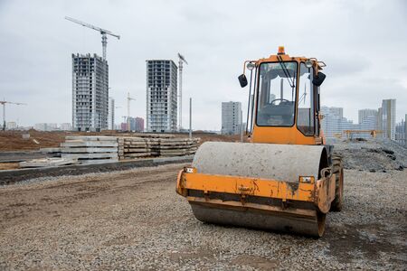 Soil Compactor at construction site. Vibration single-cylinder road roller for leveling soil,...