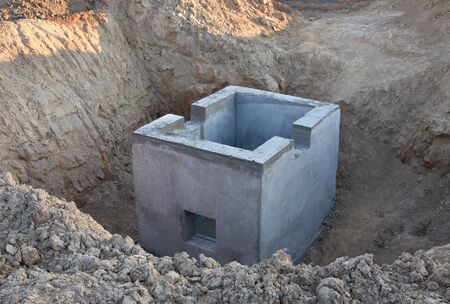 Construction of stormwater pits, sanitary sewer system distribution chamber and pump station. Sewerage manhole and pipes line under construction at the construction site. Sewage treatment works
