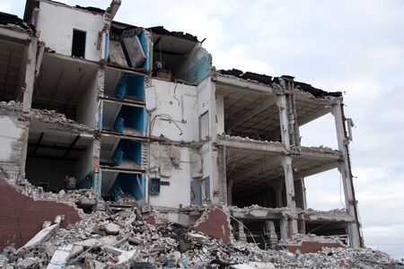 View of the demolition of a multi-storey building. Dismantling and demolition of buildings and...