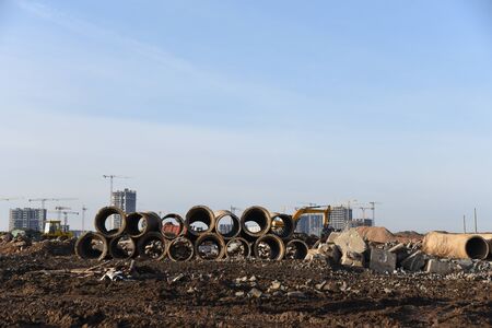 Old concrete sewer pipes for recycling. Salvaging building demolition waste and construction material.の写真素材
