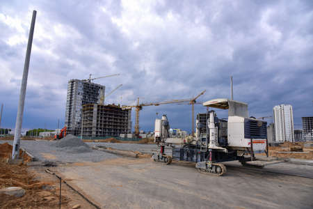 Minsk, Belarus, MAY 17, 2020: Slipform paver machine Wirtgen SP 25 at construction site