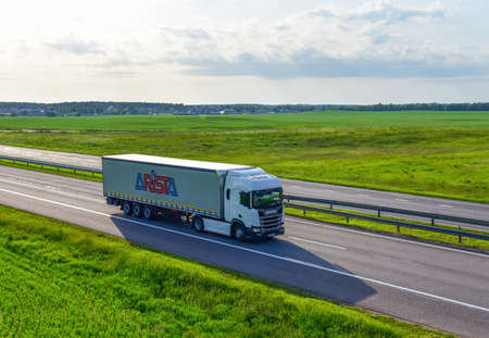 BELARUS, MINSK - JUN 07, 2020: SCANIA truck by Arista logistic company with Semi-trailer driving along highway. Goods Delivery by roads. Services and Transport logisticsのeditorial素材