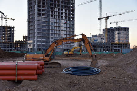 Minsk, Belarus, May 06, 2020: Excavator CASE CX210 working at construction site. Construction machinery for excavating, loading, lifting and hauling of cargo on job sitesのeditorial素材
