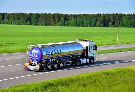 BELARUS - JUN 20, 2020: Tank truck SCANIA driving on highway. B.S.A.T. specifics of the truck...