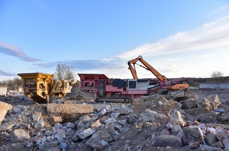 High Reach Excavator machines for demolition of tall building. Machine with hydraulic shears for...