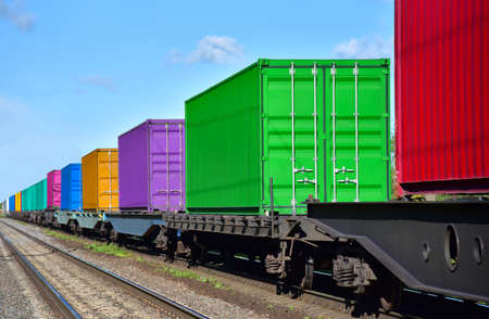 Cargo Containers Transportation On Freight Train By Railway. Intermodal Container On Train Car. Rail...