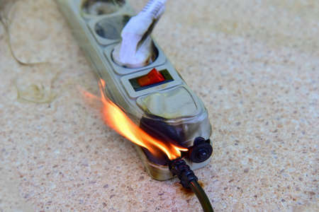 Outlets with switche caught fire in room. Overloaded electrical current or short in device from many...