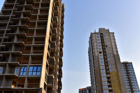 Construction of skeleton of modern residential buildings. Erection multi-storey building. Mineral...