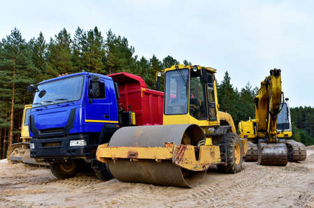Dump truck, Excavator, Dozer and Vibro Roller Soil Compactor at road construction and bridge...