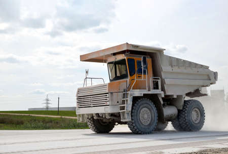Mining truck transports chalk from open pit to an industrial plant for the needs of the construction...