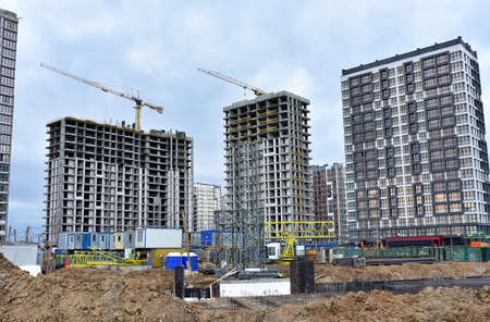 View of the larger construction site. Construction of multi-storey residential buildings. Tower...