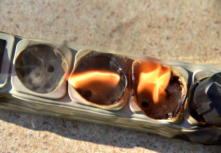 Outlets with switche caught fire in room. Overloaded electrical current or short in device from many...