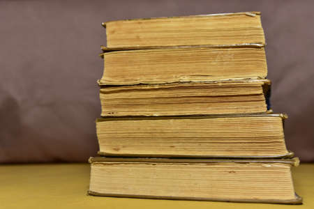 Old books on brown background. Book for reading stories. Literature and historical concept,...