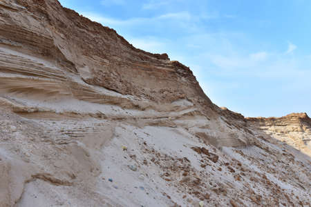 Land structure in open pit mining. Ground background in quarry. Rock texture during earthworks. Sand background and Earth's crust.の写真素材