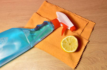 Detergent spray cleaner on purple background. Detergents for washing windows and cleaning dishes....