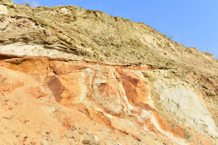 Land structure in open pit mining. Ground background in quarry. Rock texture during earthworks. Sand...