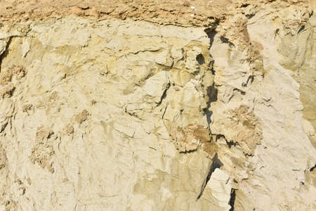 Land structure in open pit mining. Ground background in quarry. Rock texture during earthworks. Sand background and Earth's crust.の写真素材